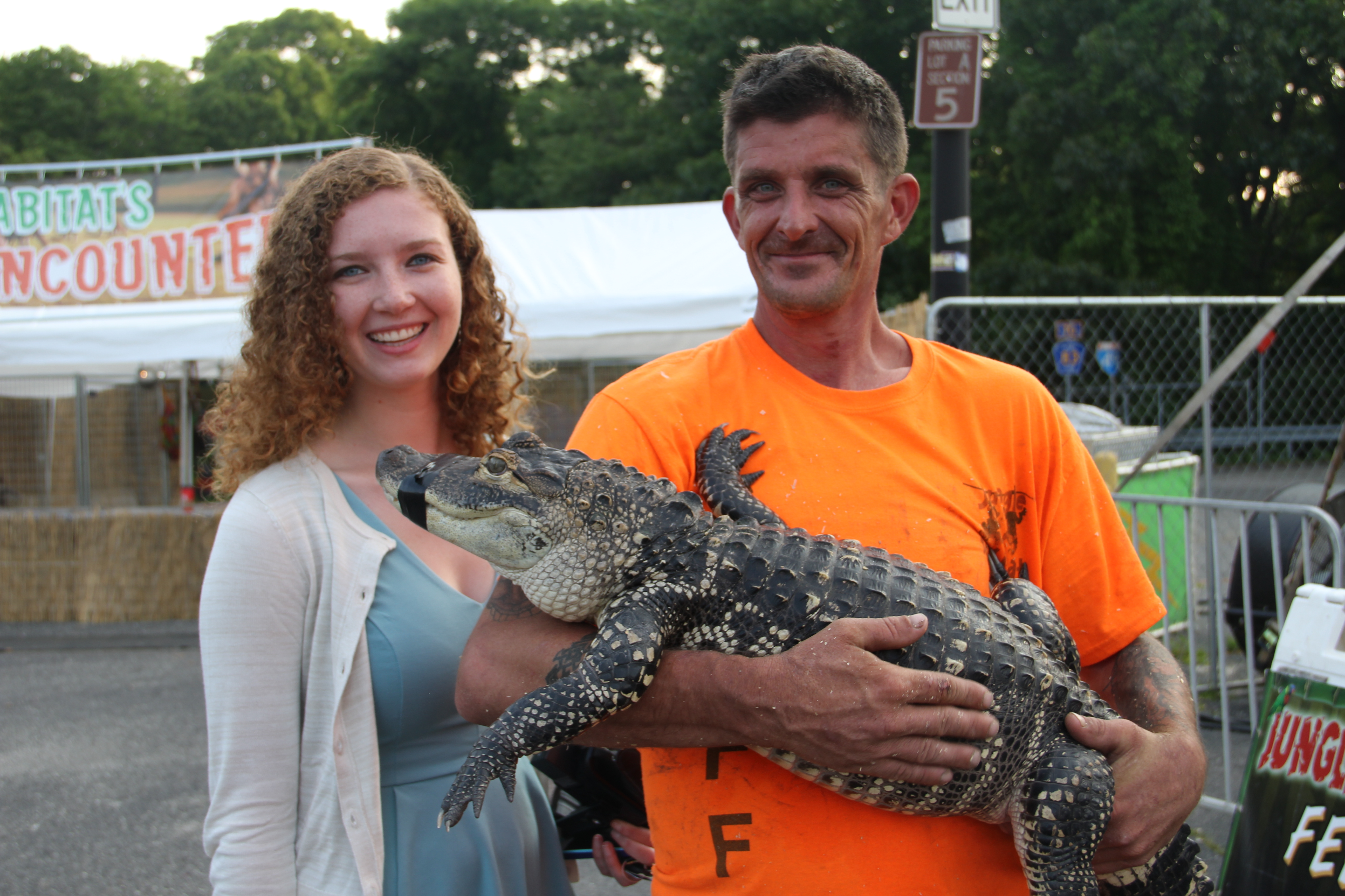 One of our Summer 2015 interns Tara with a gator handler at the 2015 Brookhaven Town Fair.