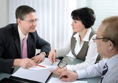 A financial advisor consults with clients.